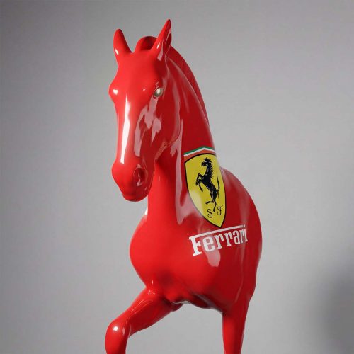 Life-size bust of a red Ferrari horse on a pedestal